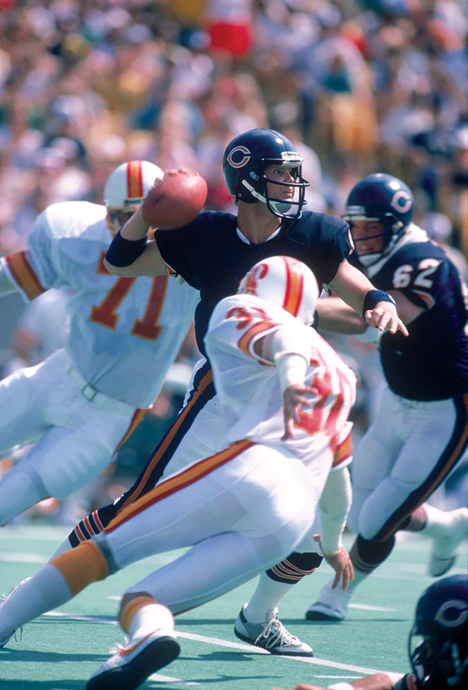 Quarterback Jim McMahon of the Green Bay Packers warms up prior to